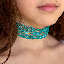 Load image into Gallery viewer, Model is wearing Spririted Grace choker in turquoise finish cord.  The choker is embellished with Turquoise gemstone and 24k gold plated beads
